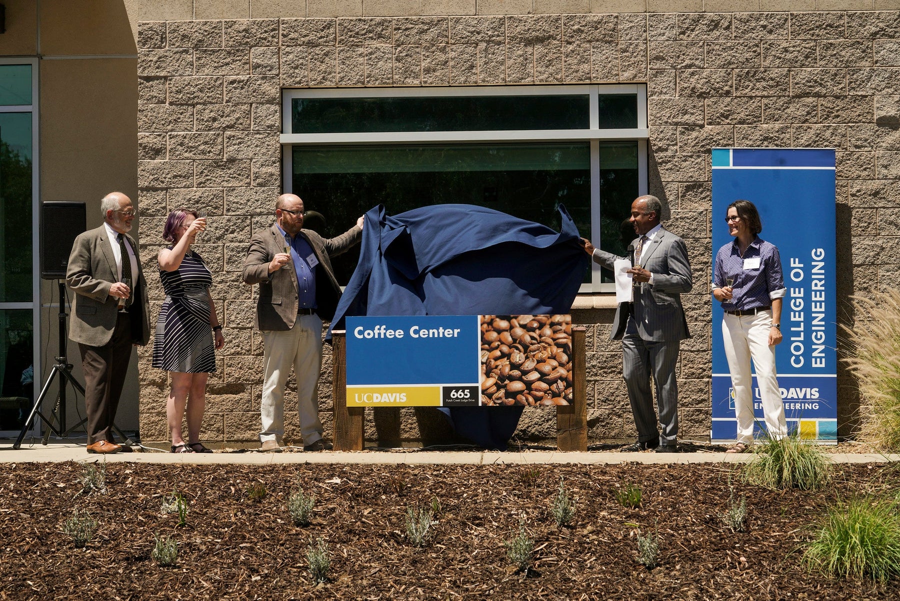 UC Davis College of Engineering Dean, UC Davis Chancellor, Professors Ristenpart, Batali and Kuhl, unveil the coffee center's new sign