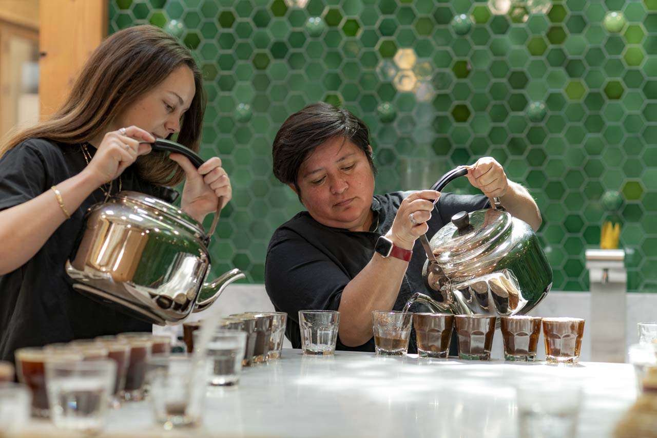 pouring hot water for a coffee cupping