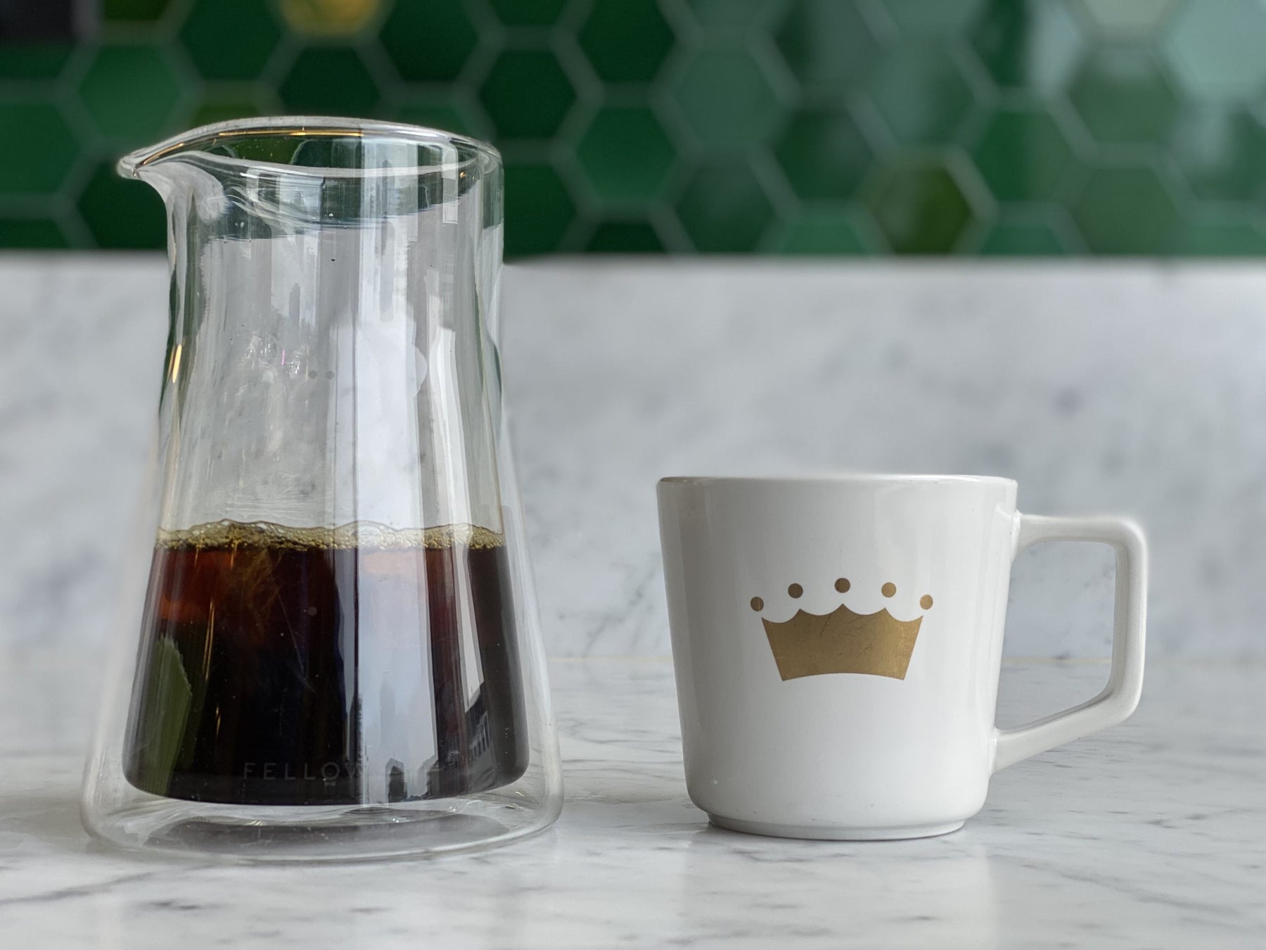 coffee mug with glass pitcher of coffee