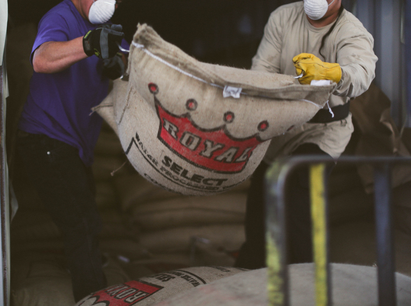 Specialty green coffee being unloaded at the Royal Coffee Warehouse