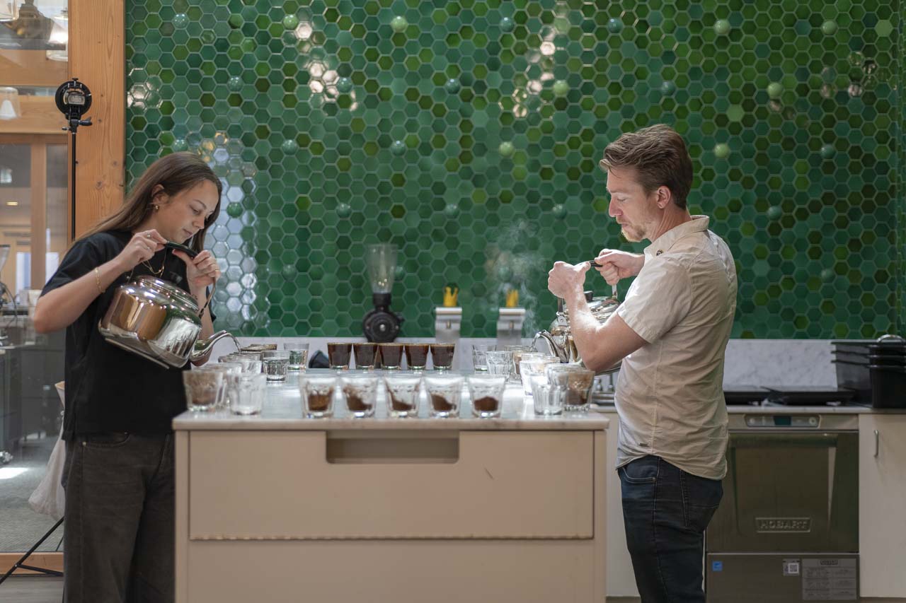 Isabella and Chris cupping coffee